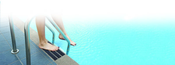 Grab bars ladder in blue swimming pool